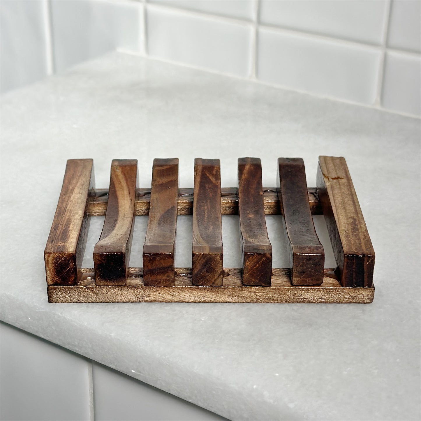 Simple brown slotted bamboo soap dish to keep soap 'high and dry'