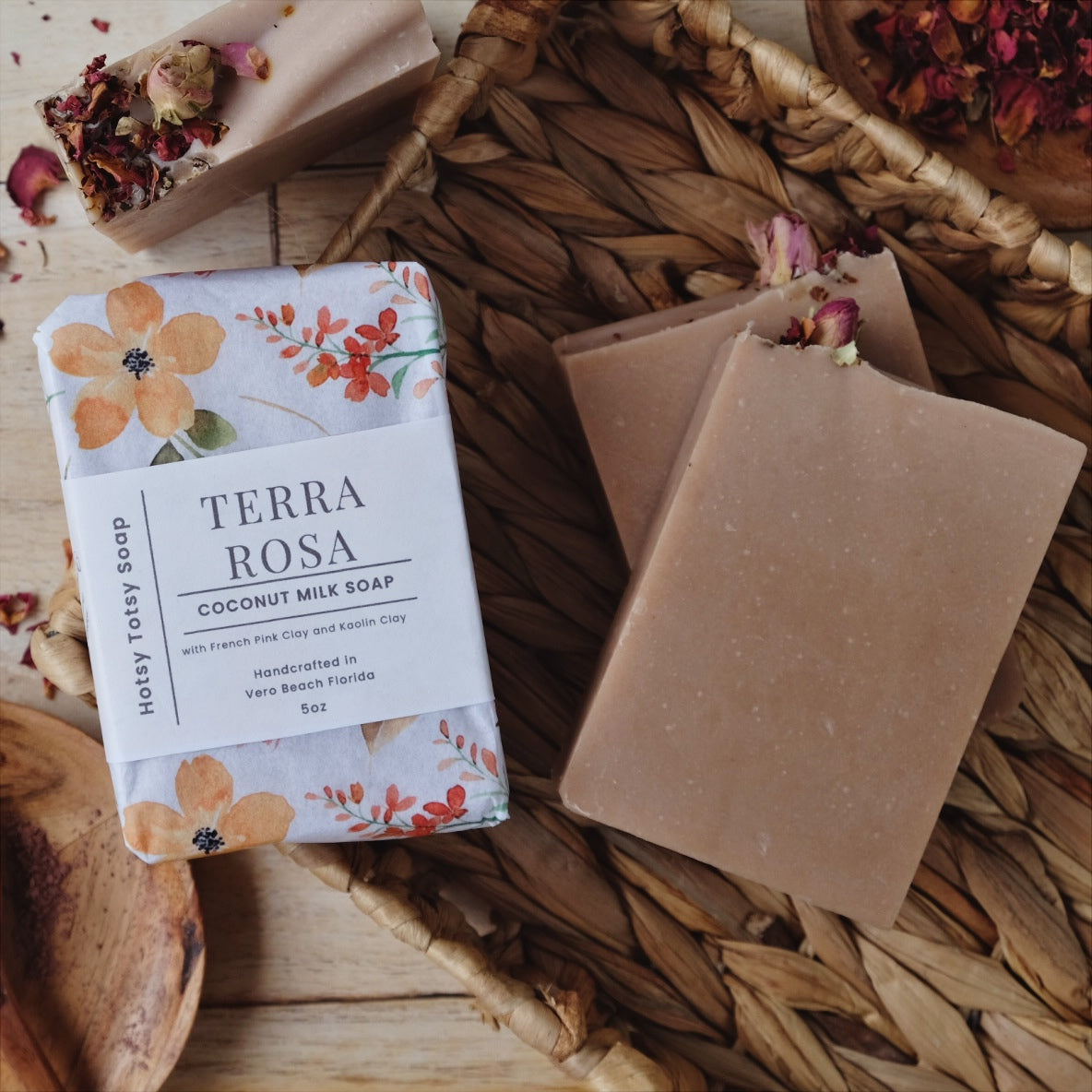 Blush colored Terra Rosa coconut milk soap bars are Naturally scented with an earthy blend of Patchouli and geranium essential oils. Each 5 ounce soap is wrapped in beautiful floral paper and labeled with a cigar band.