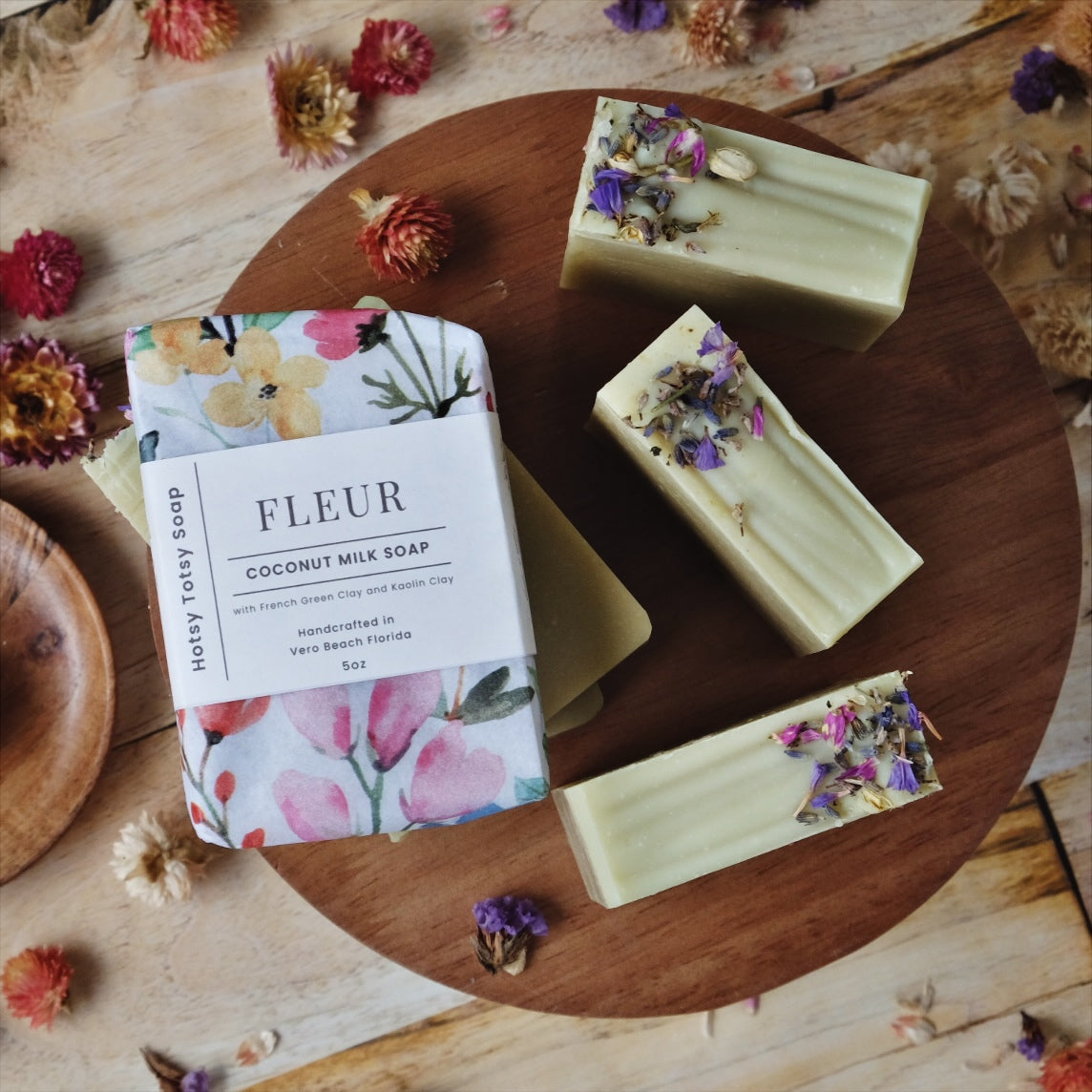 Coconut milk soap scented with  lavender, ylang ylang, frankincense and cedarwood. atlas. Colored with french green clay and decorated with dried flowers. Each bar is wrapped in decorative floral paper.