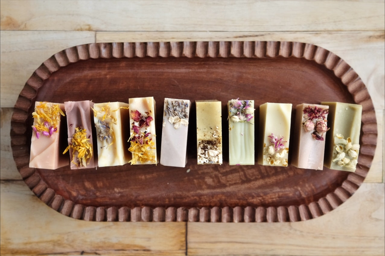 10 bars of coconut milk soaps makes up our complete, all-natural line of soap. Each bar uniquely crafted with essential oils and colorants from the earth. All soaps come wrapped in beautiful paper and labeled with a cigar band. 