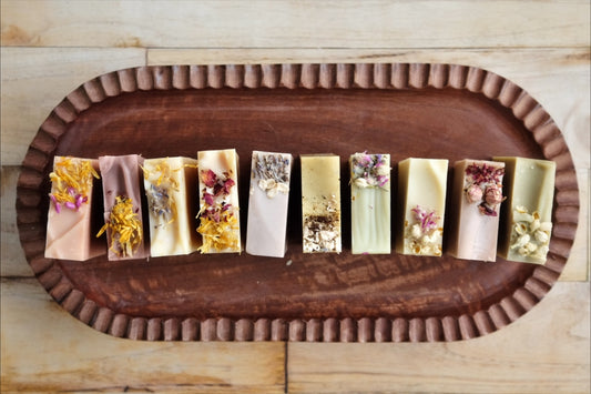 10 bars of coconut milk soaps makes up our complete, all-natural line of soap. Each bar uniquely crafted with essential oils and colorants from the earth. All soaps come wrapped in beautiful paper and labeled with a cigar band. 