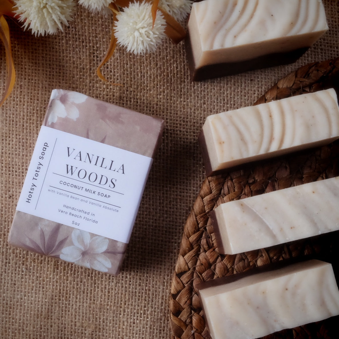 Vanilla Woods soap bar with packaging on a textured surface